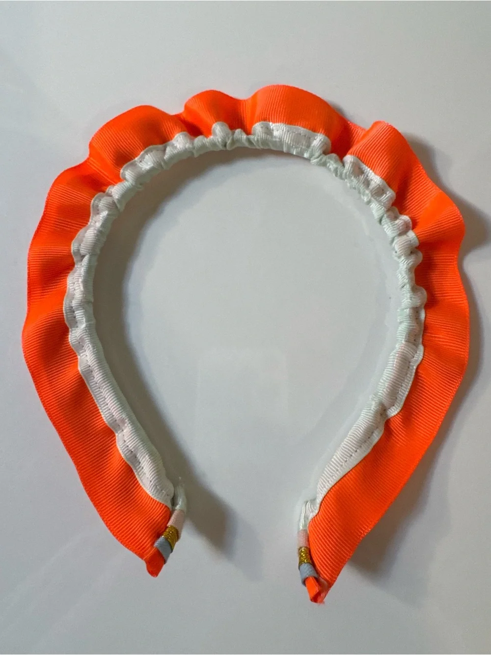 Meri Meri Neon Orange Trim Multicolor Ruffled Headband with metallic gold trim